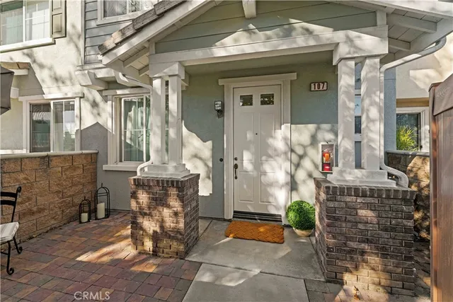 a front view of a house with outdoor seating