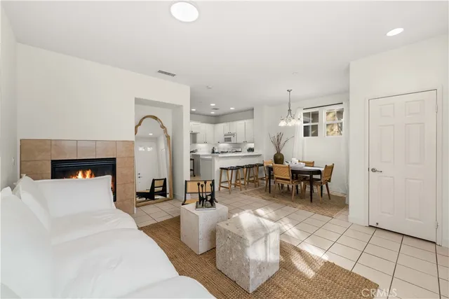 a living room with furniture a table and chairs