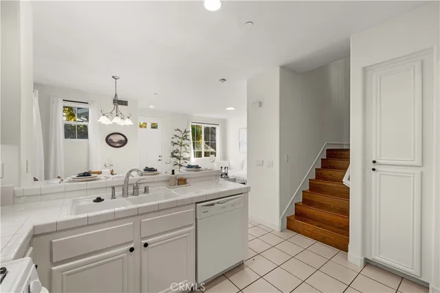 a spacious bathroom with a double vanity sink and a mirror