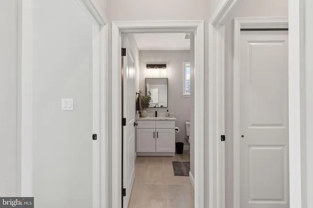 a bathroom with a sink and mirror
