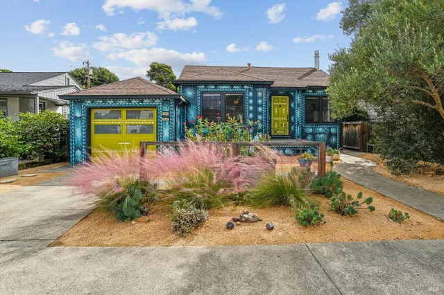 a front view of a house with garden