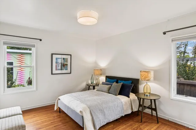 a bedroom with bed and window