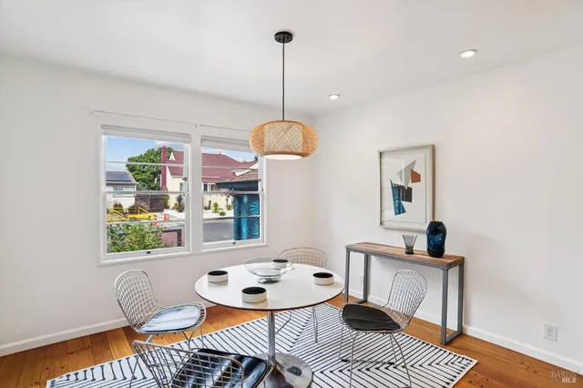a dining room with furniture and window
