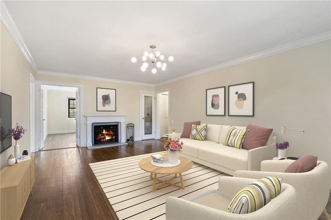 6 Davis Avenue, Unit C31 Rye, NY 10580 - Photo 1 of 1 a living room with furniture and a fireplace
