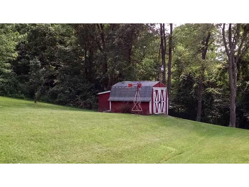 108 Willow Road Rillton, PA 15678 - Photo 24 of 25 Storage. Fire pit on other side of shed