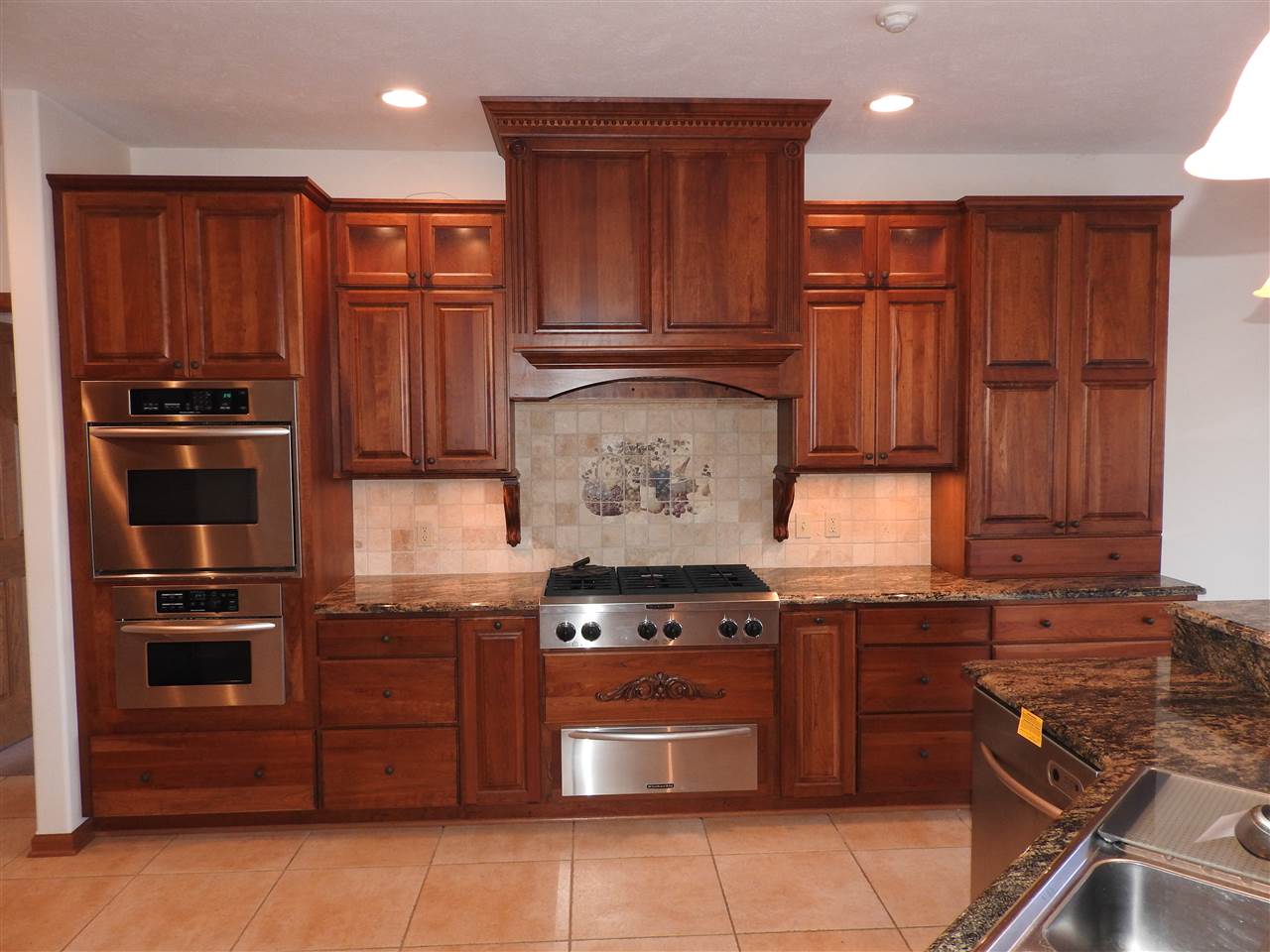 1917 Baintree Road Lake Summerset, IL 61019 - Photo 4 of 25 a kitchen with stainless steel appliances granite countertop a stove and a refrigerator