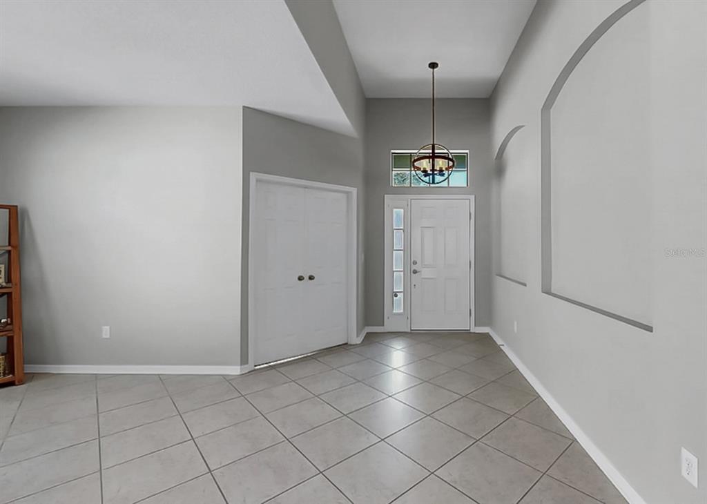 7109 Spindle Tree Lane Riverview, FL 33578 - Photo 13 of 42 a view of a kitchen cabinets and window