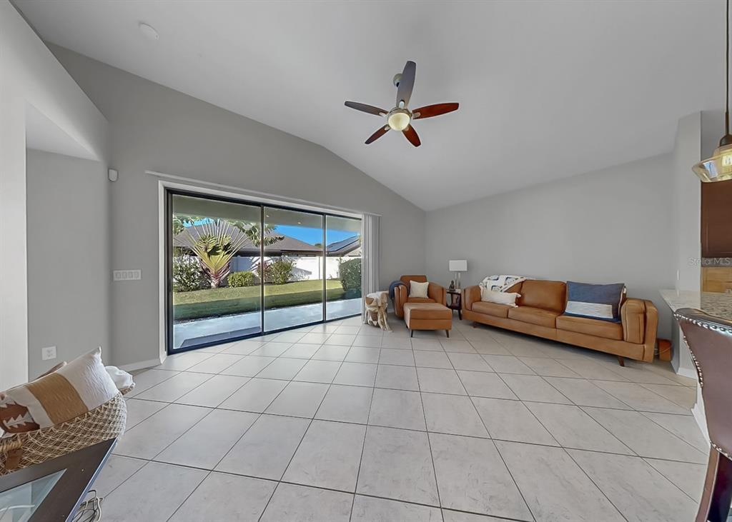 7109 Spindle Tree Lane Riverview, FL 33578 - Photo 26 of 42 a living room with furniture and a flat screen tv