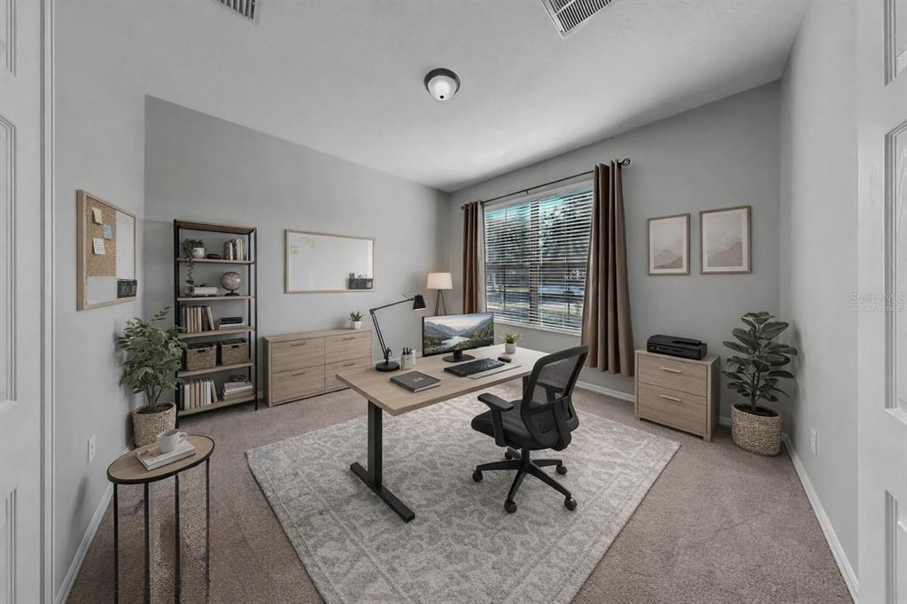 7109 Spindle Tree Lane Riverview, FL 33578 - Photo 41 of 42 a workspace with lounge chair and a window