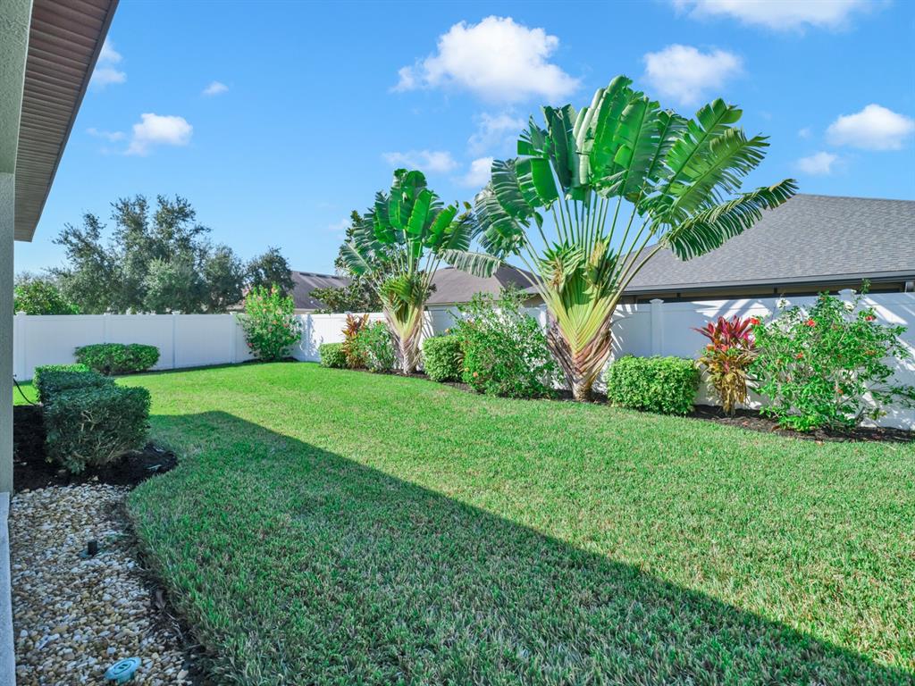 7109 Spindle Tree Lane Riverview, FL 33578 - Photo 7 of 42 a view of a garden with a fountain