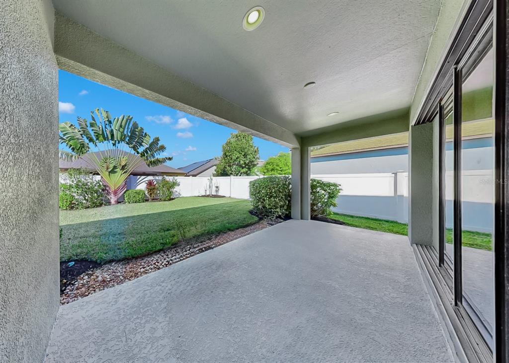 7109 Spindle Tree Lane Riverview, FL 33578 - Photo 9 of 42 a view of a porch and garden