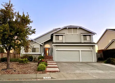 a front view of a house with garage