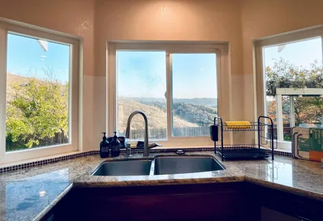 a kitchen with a sink and a window