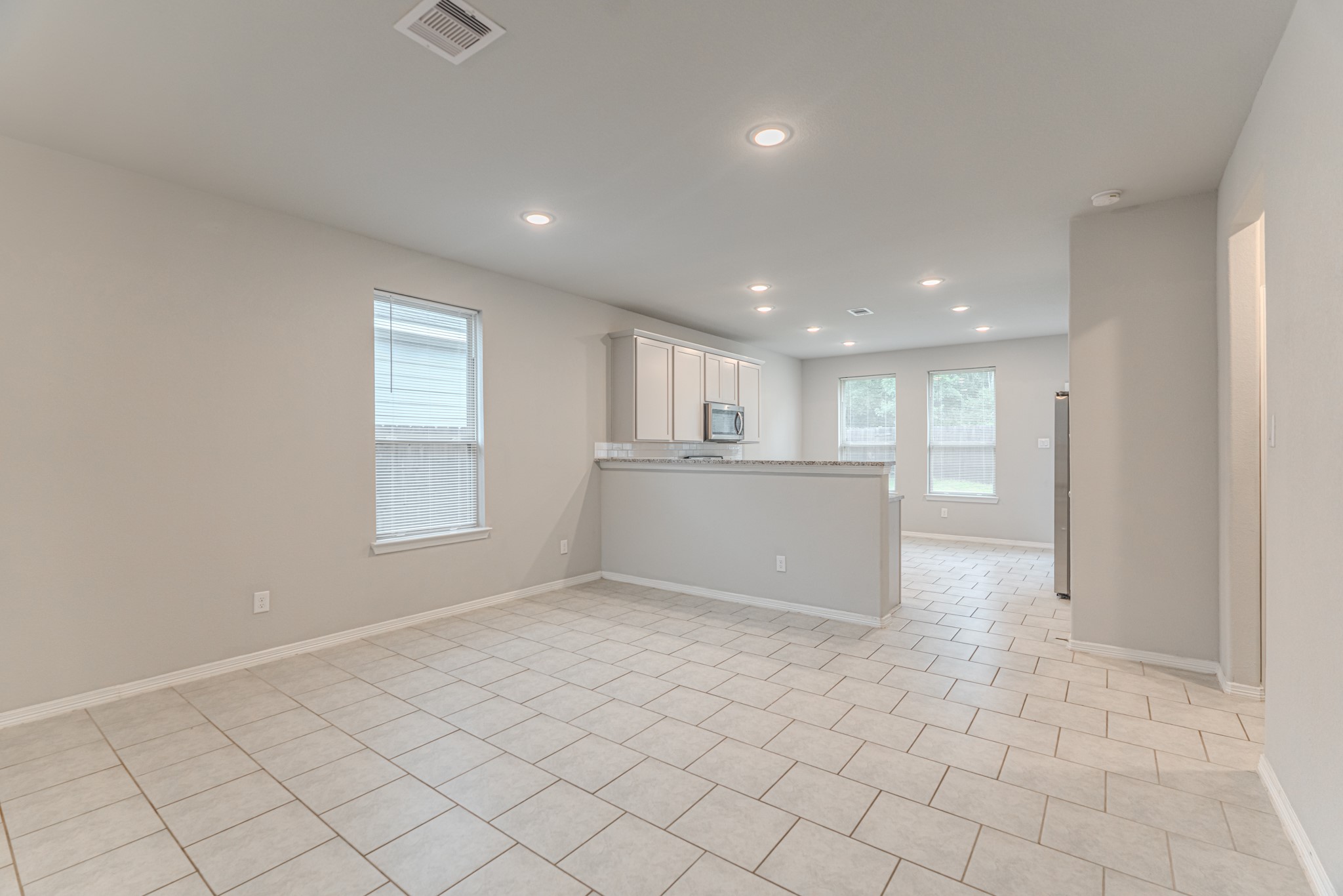 25706 Boxwood Hedge Lane Tomball, TX 77375 - Photo 14 of 44 a view of an empty room and a window