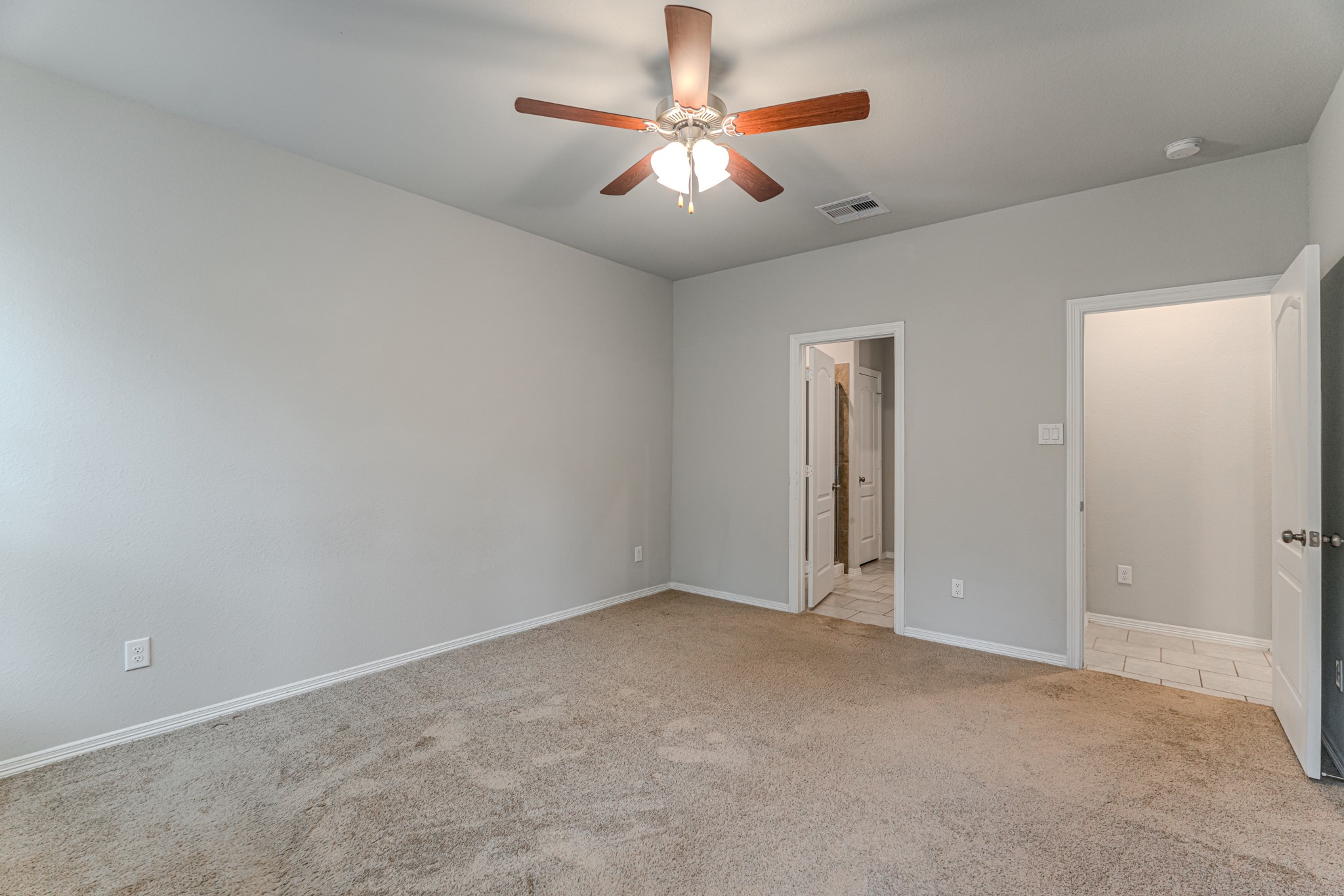 25706 Boxwood Hedge Lane Tomball, TX 77375 - Photo 22 of 44 a view of an empty room and chandelier fan
