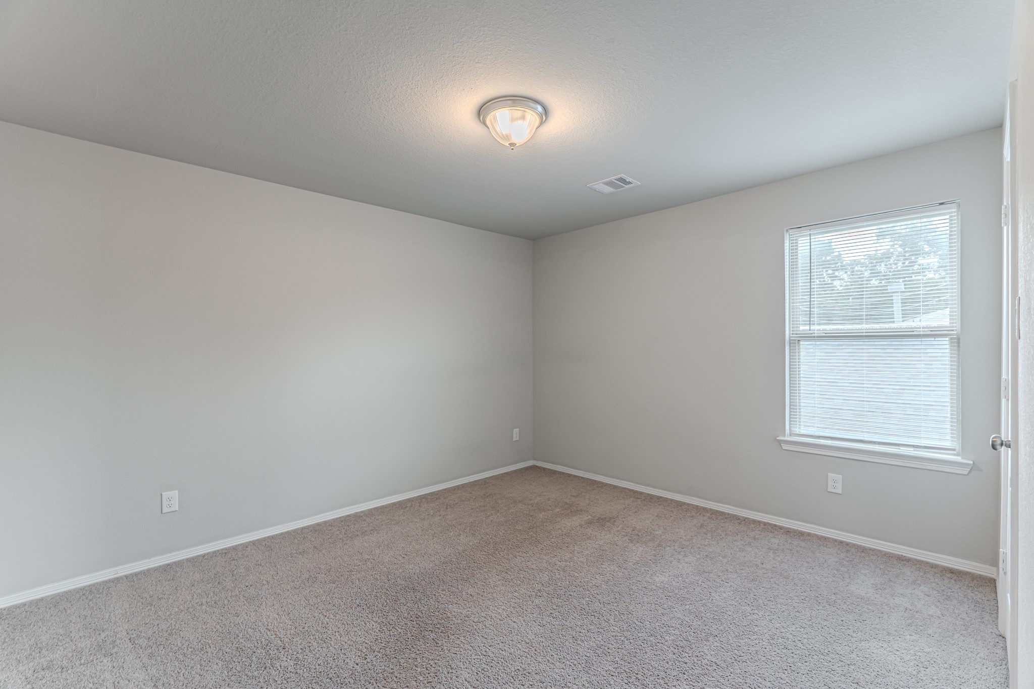 25706 Boxwood Hedge Lane Tomball, TX 77375 - Photo 34 of 44 an empty room with windows