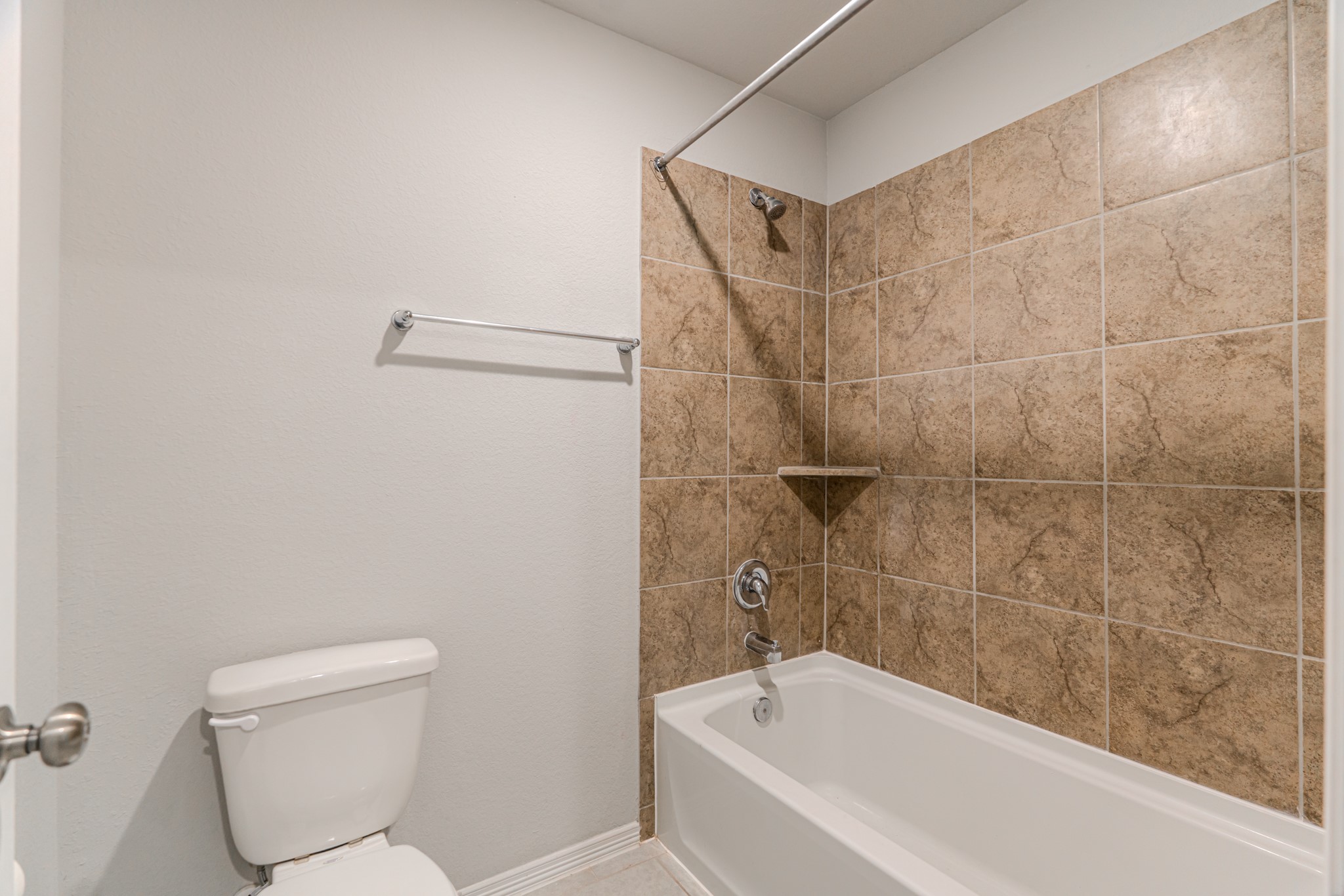 25706 Boxwood Hedge Lane Tomball, TX 77375 - Photo 37 of 44 a bathroom with a toilet and a bathtub