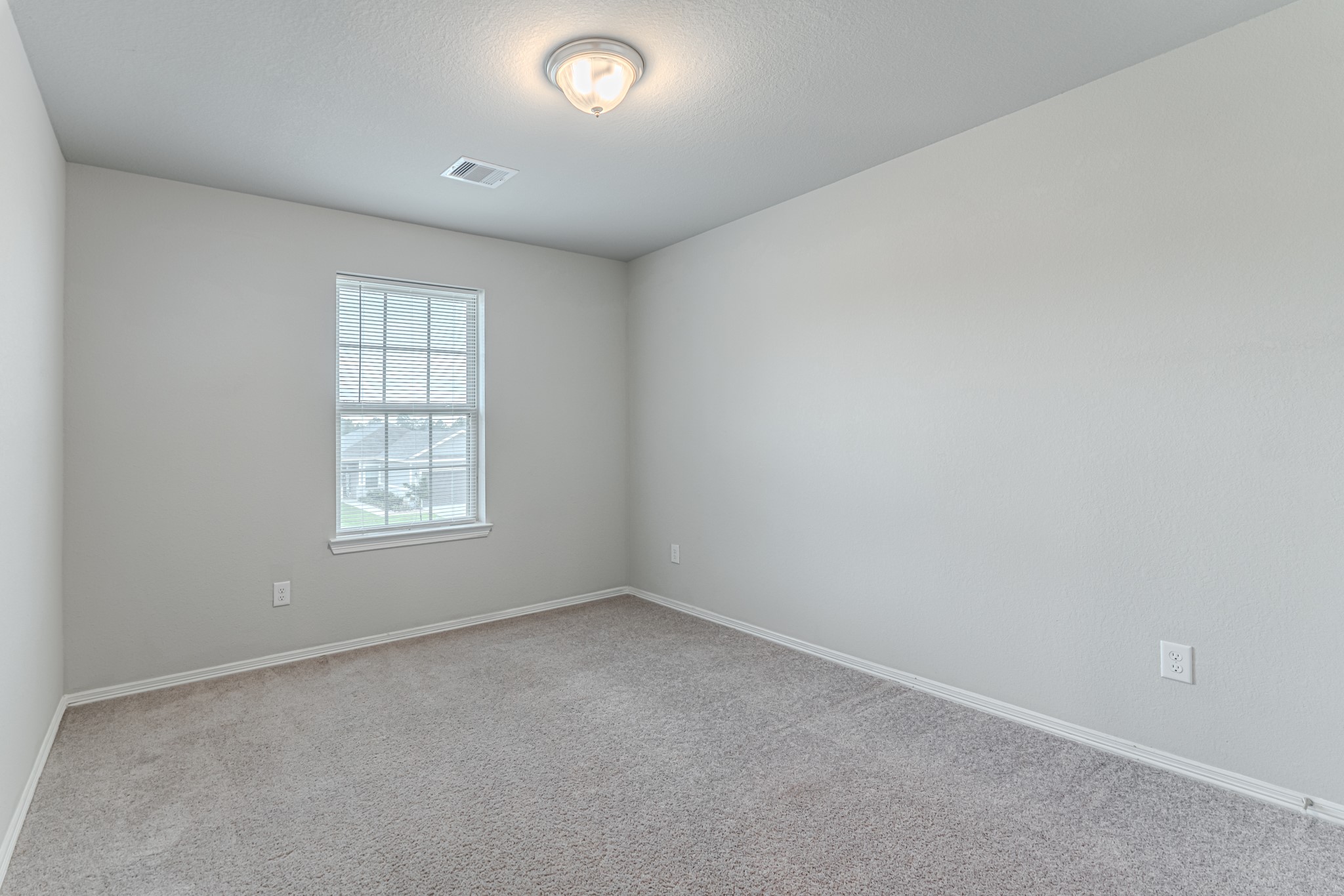 25706 Boxwood Hedge Lane Tomball, TX 77375 - Photo 38 of 44 an empty room with a window