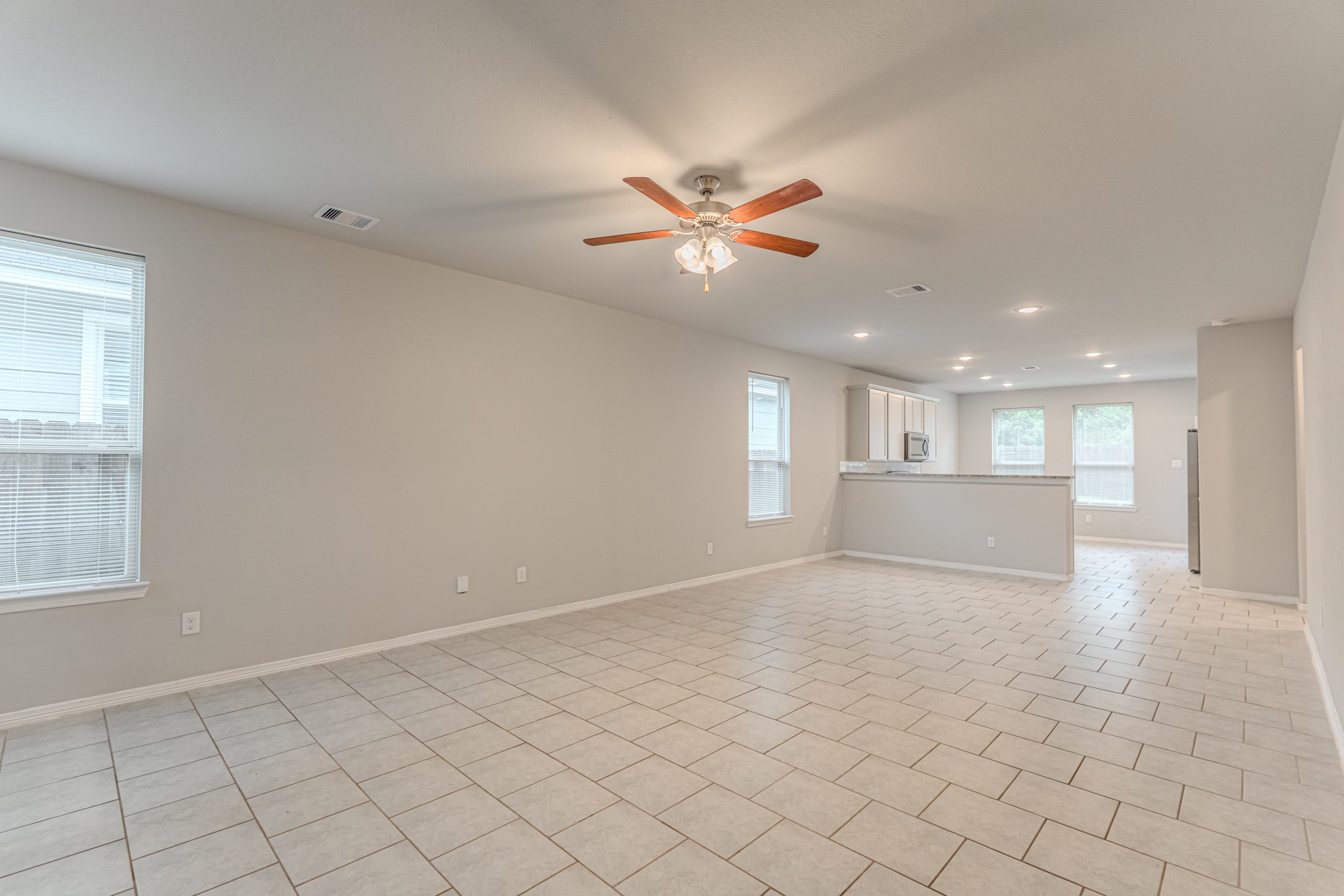 25706 Boxwood Hedge Lane Tomball, TX 77375 - Photo 10 of 44 a view of a kitchen with a sink and a window