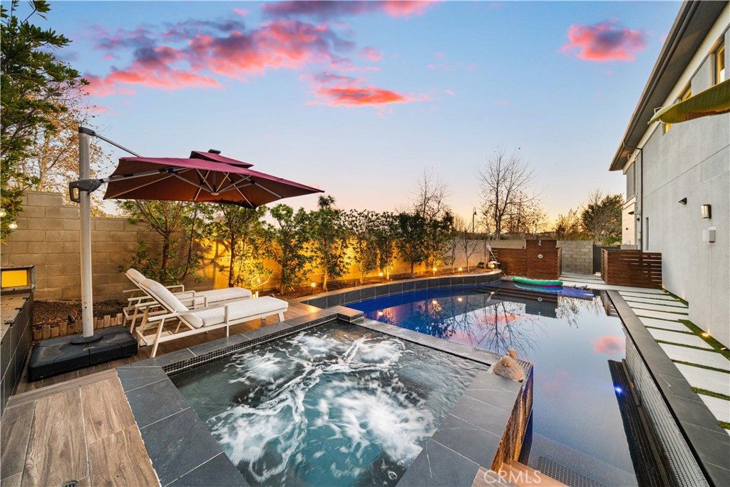 83 Lunar Irvine, CA 92618 - Photo 7 of 75 a view of a swimming pool with a lounge chairs
