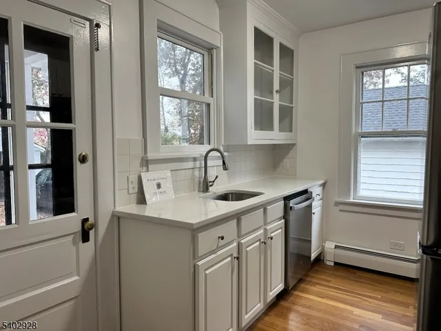 a kitchen with a sink and a window