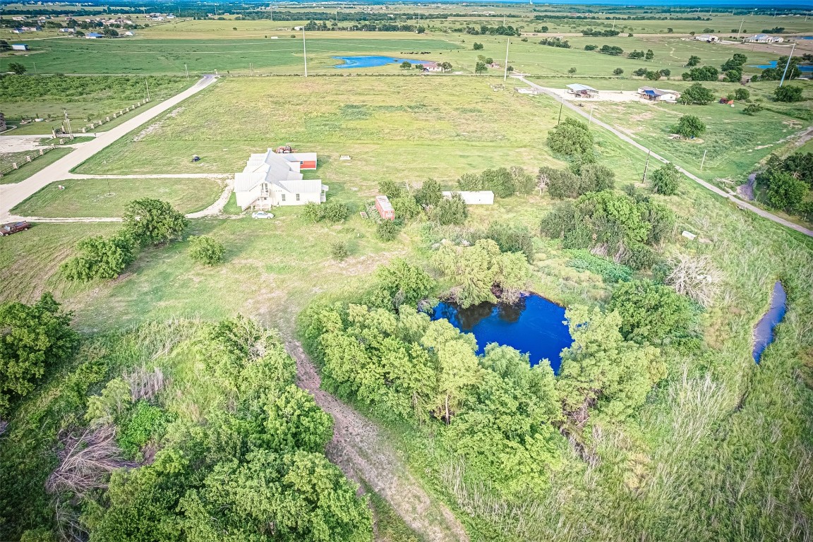 a view of a swimming pool and a yard