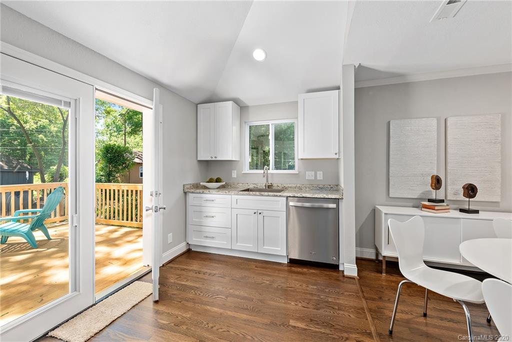 1416 Cortland Road East Charlotte, NC 28209 - Photo 20 of 26 a kitchen with a sink cabinets and window