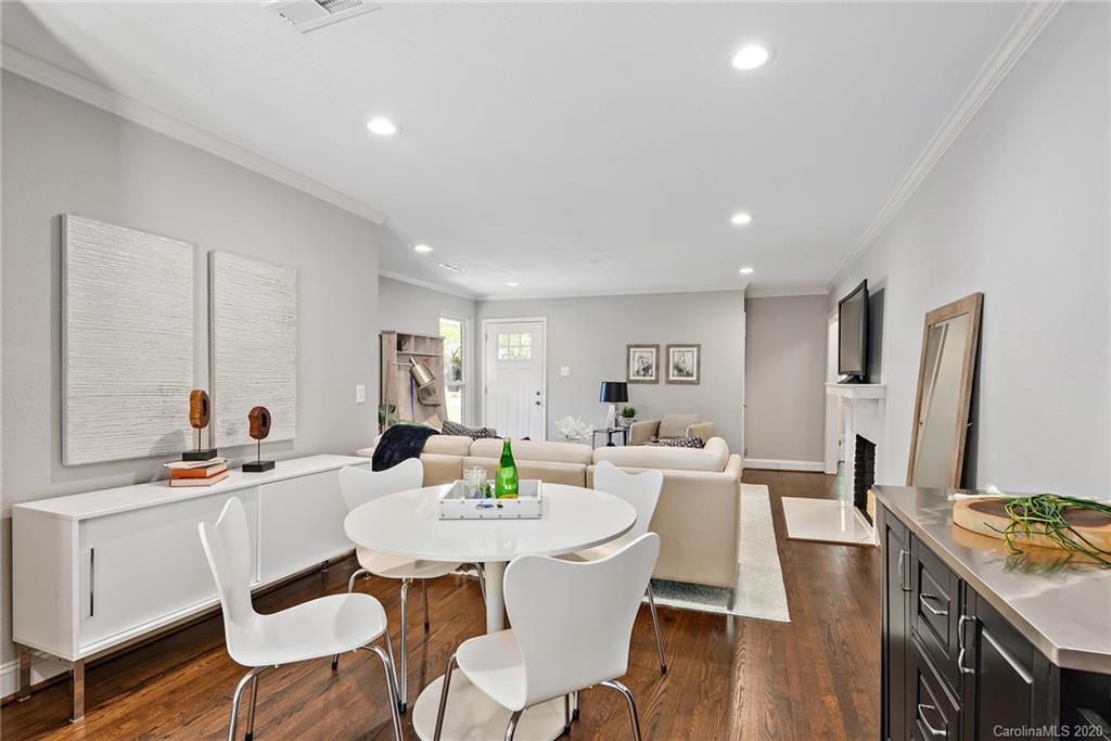 1416 Cortland Road East Charlotte, NC 28209 - Photo 3 of 26 a view of a dining room with furniture and wooden floor