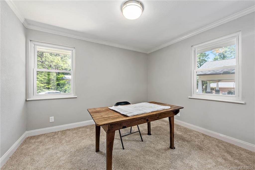 1416 Cortland Road East Charlotte, NC 28209 - Photo 23 of 26 a room with furniture and a window