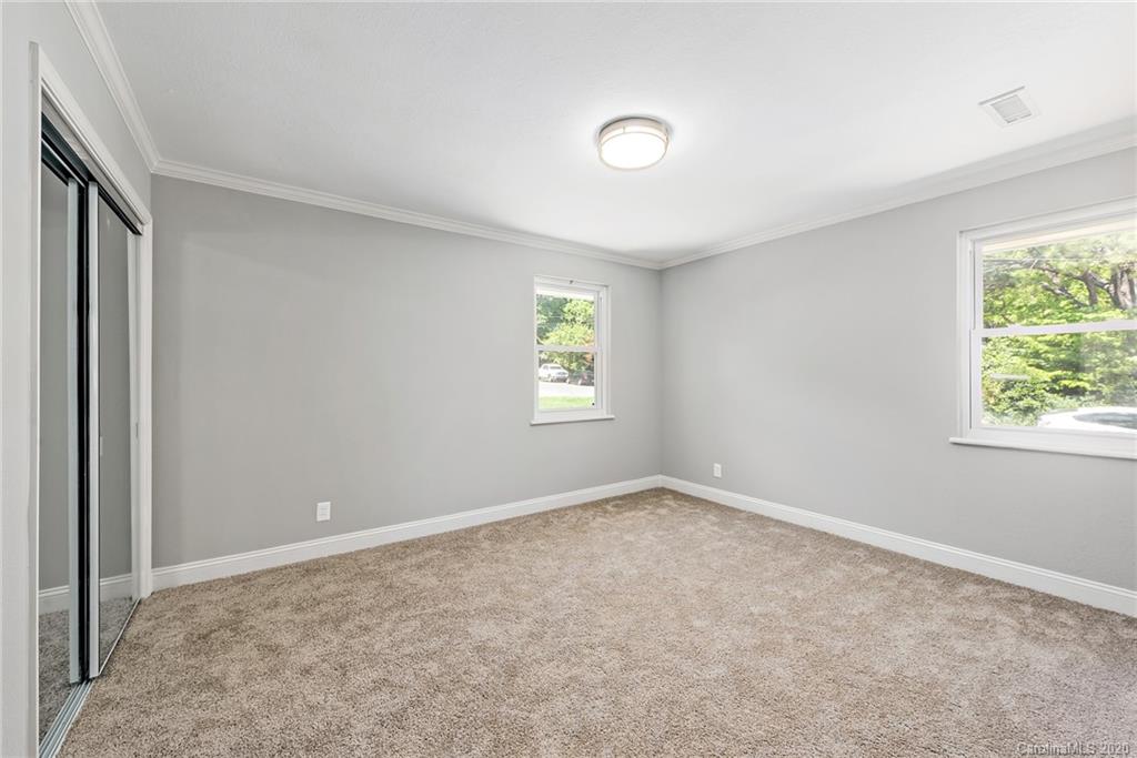 1416 Cortland Road East Charlotte, NC 28209 - Photo 24 of 26 an empty room with windows
