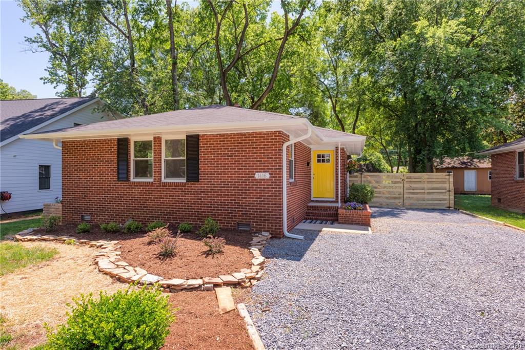1416 Cortland Road East Charlotte, NC 28209 - Photo 4 of 26 a front view of a house with a yard