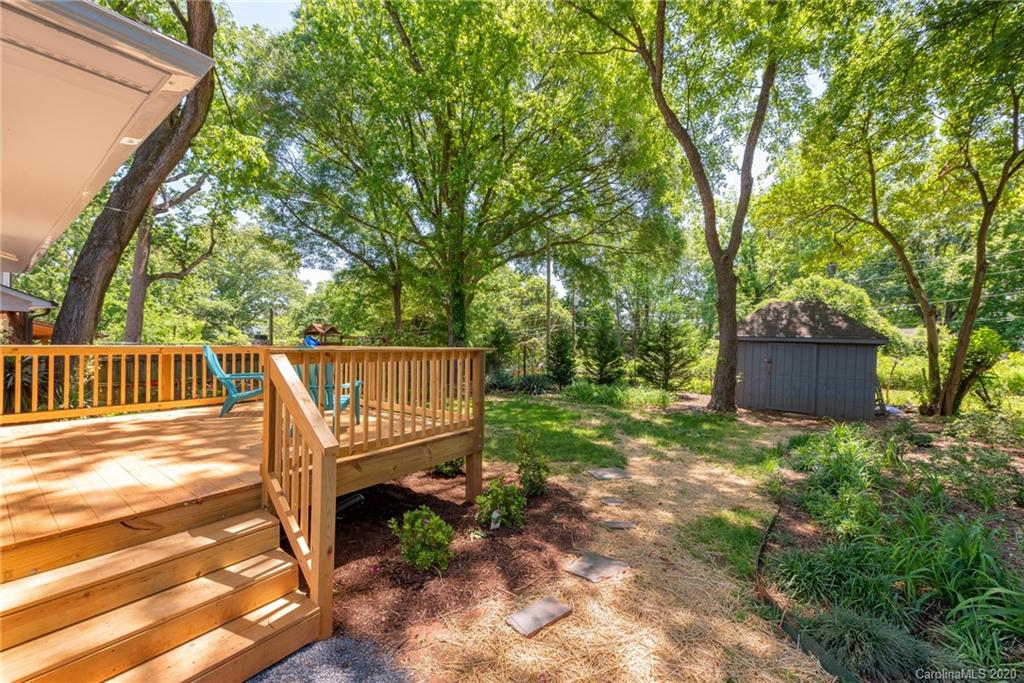 1416 Cortland Road East Charlotte, NC 28209 - Photo 9 of 26 a view of a chair and table in the garden
