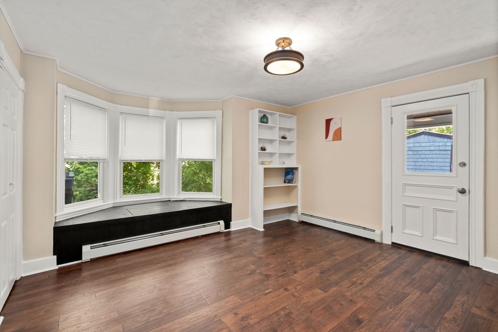 448 Washington Street Warren, MA 01083 - Photo 14 of 42 wooden floor in an empty room with a window
