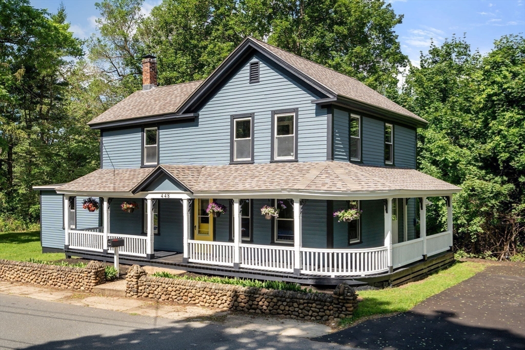 448 Washington Street Warren, MA 01083 - Photo 2 of 42 a house with a large window and wooden fence