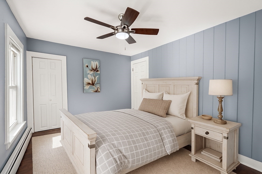 448 Washington Street Warren, MA 01083 - Photo 21 of 42 a bedroom with a bed and a lamp on table