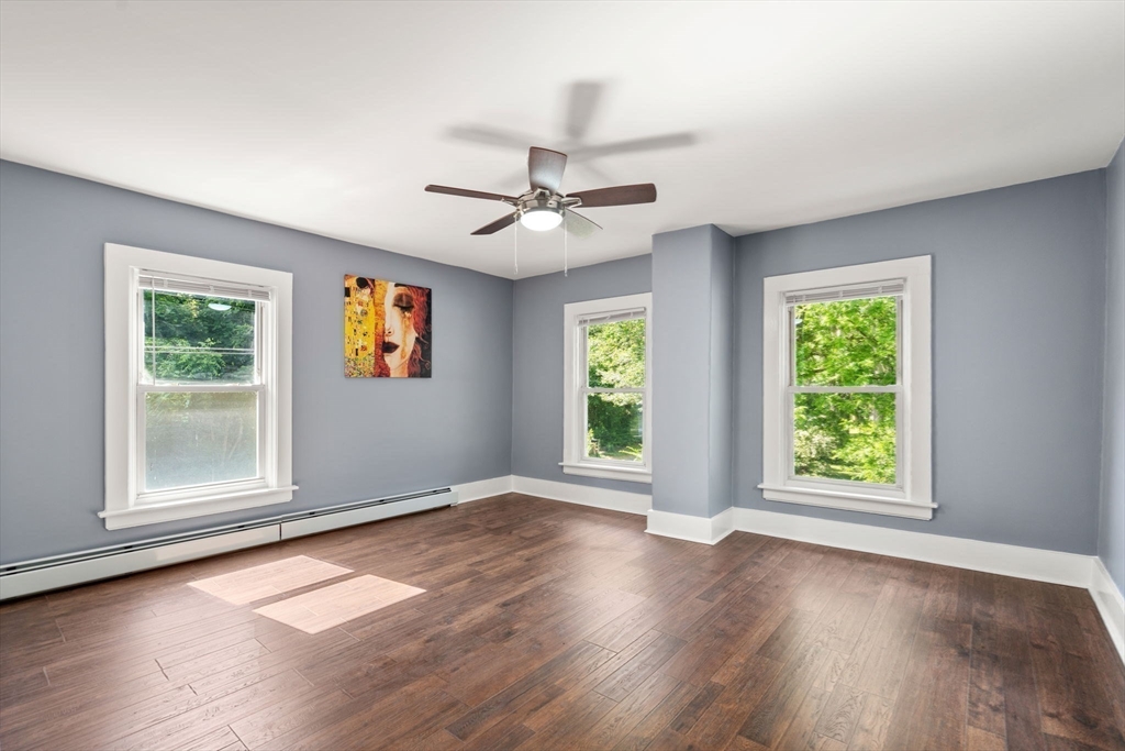 448 Washington Street Warren, MA 01083 - Photo 28 of 42 a view of an empty room with wooden floor and a window