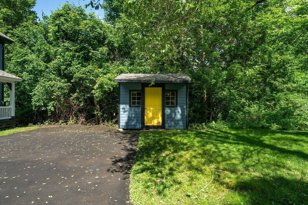 448 Washington Street Warren, MA 01083 - Photo 32 of 42 a front view of a house with garden