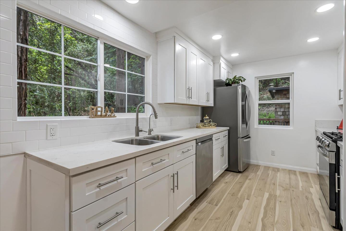 17550 Comanche Trail Los Gatos, CA 95033 - Photo 11 of 37 a kitchen with a sink stove and refrigerator