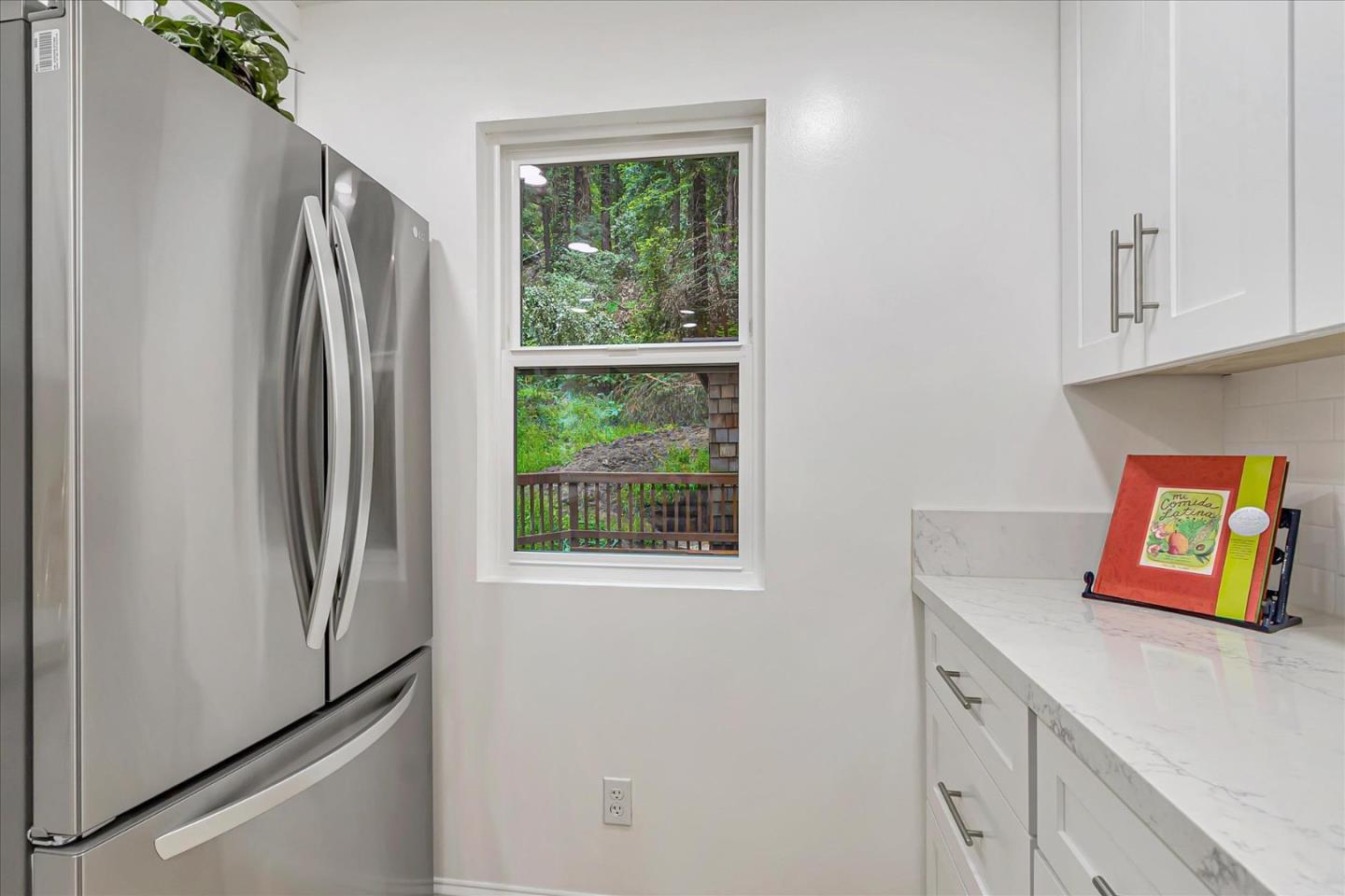 17550 Comanche Trail Los Gatos, CA 95033 - Photo 13 of 37 a kitchen with stainless steel appliances granite countertop a refrigerator and a sink