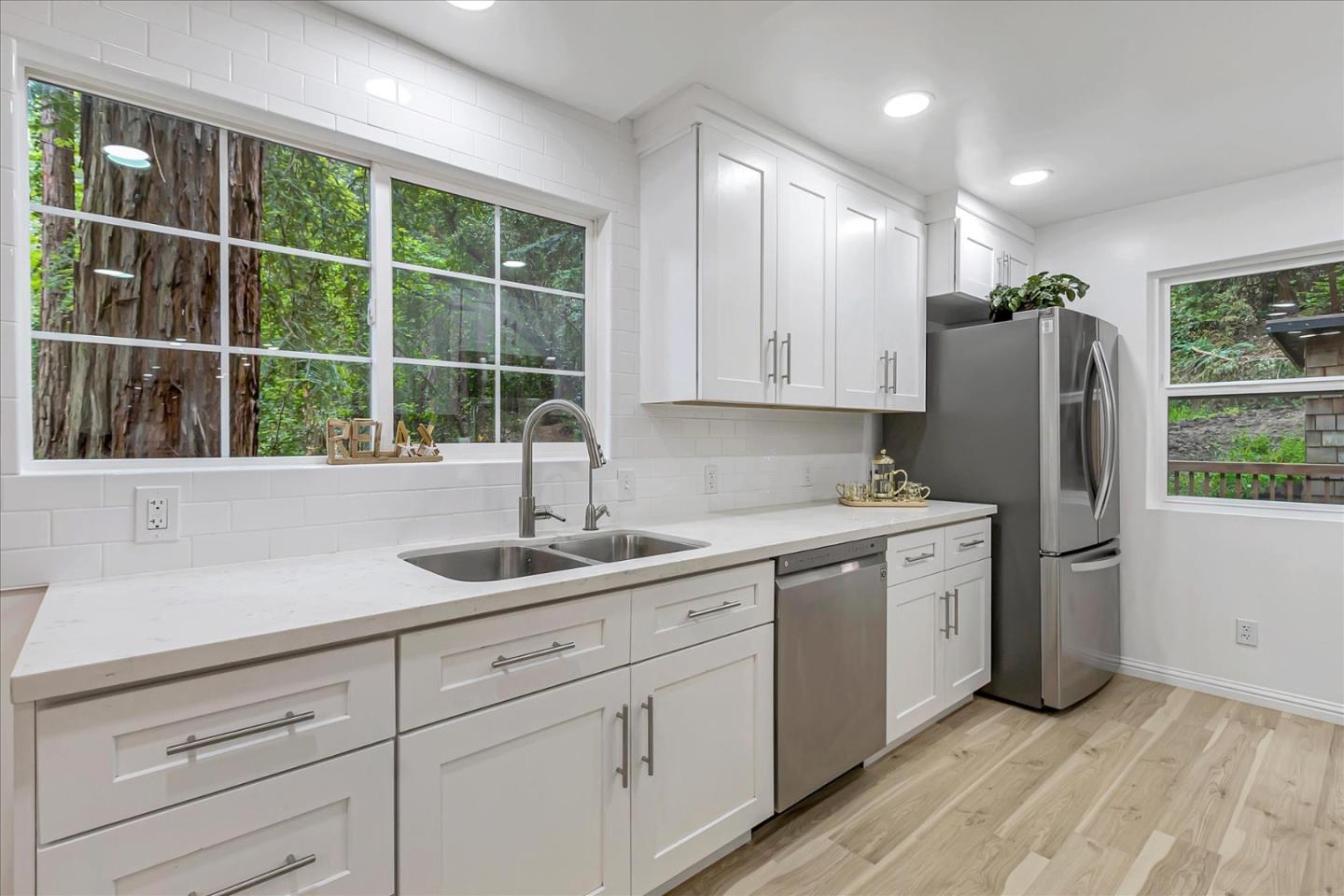 17550 Comanche Trail Los Gatos, CA 95033 - Photo 16 of 37 a kitchen with stainless steel appliances sink refrigerator and window