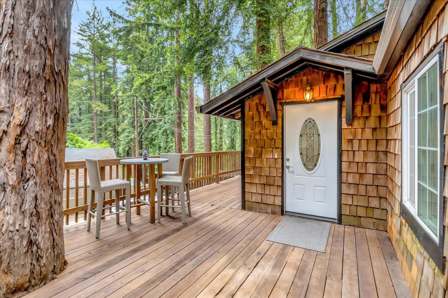 17550 Comanche Trail Los Gatos, CA 95033 - Photo 6 of 37 a view of a house with a wooden deck and furniture
