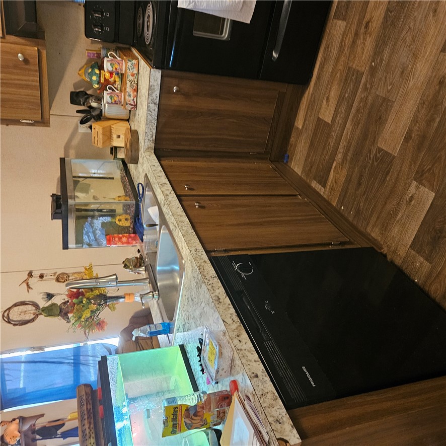 148 Persimmon Drive Pickens, SC 29671 - Photo 2 of 14 This functional kitchen features ample counter space and essential appliances, offering everyday convenience.