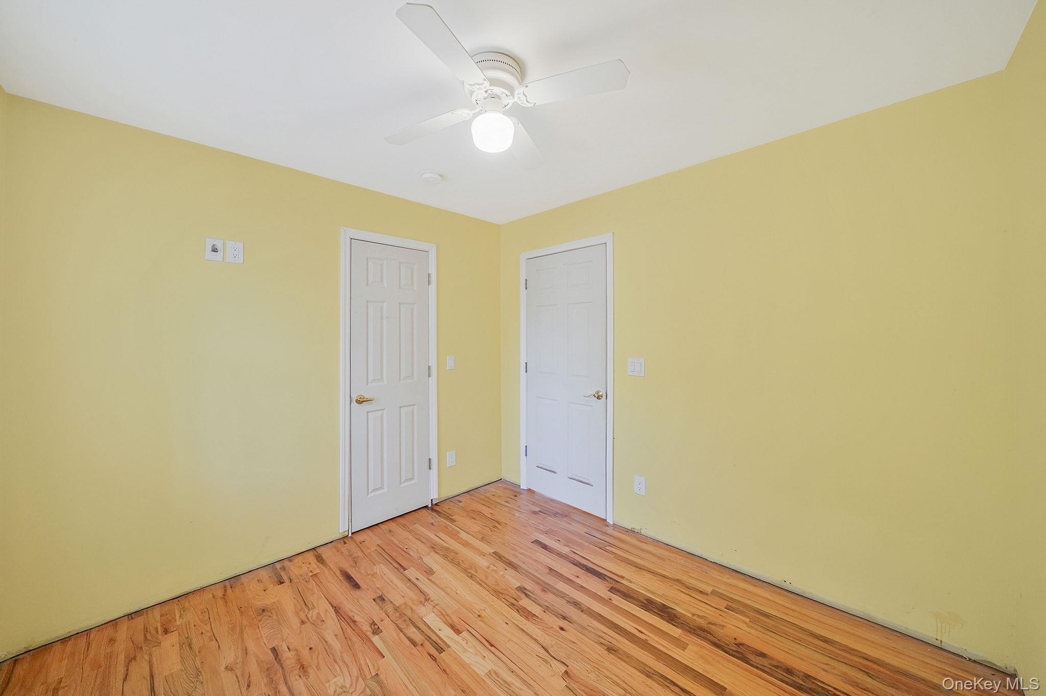 97 Locust Drive Rocky Point, NY 11778 - Photo 19 of 26 Spare room featuring light wood finished floors and ceiling fan