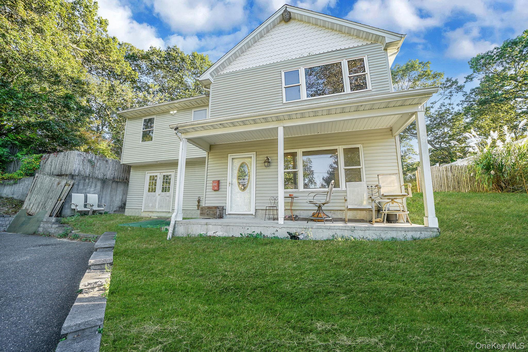 97 Locust Drive Rocky Point, NY 11778 - Photo 4 of 26 View of front facade with covered porch