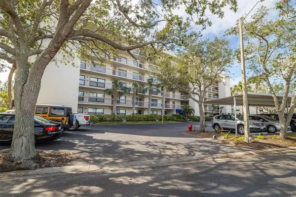a view of street with parked cars