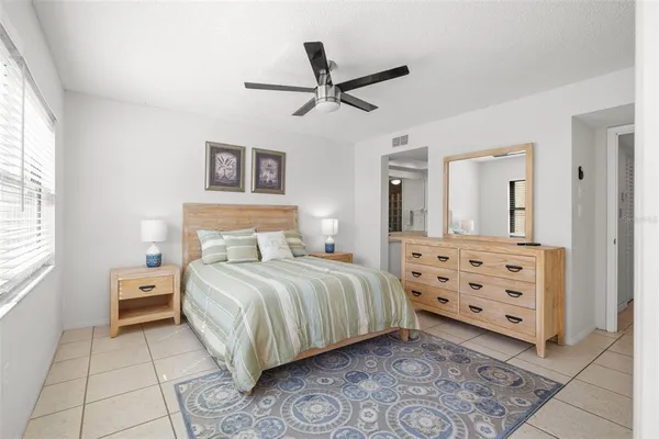 a bedroom with a bed and window