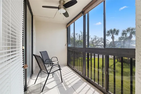 a view of a balcony with furniture