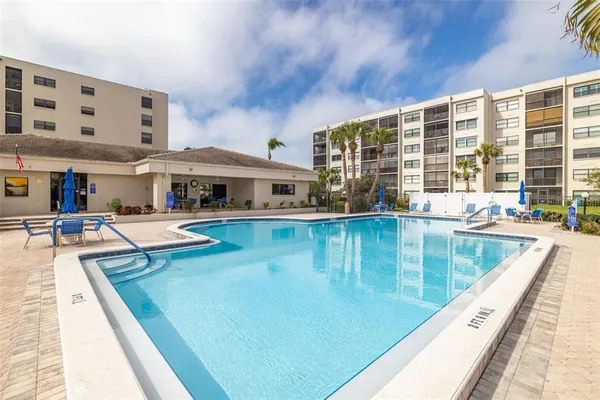 a view of a swimming pool with a patio