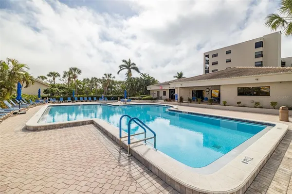 a view of a swimming pool with a patio