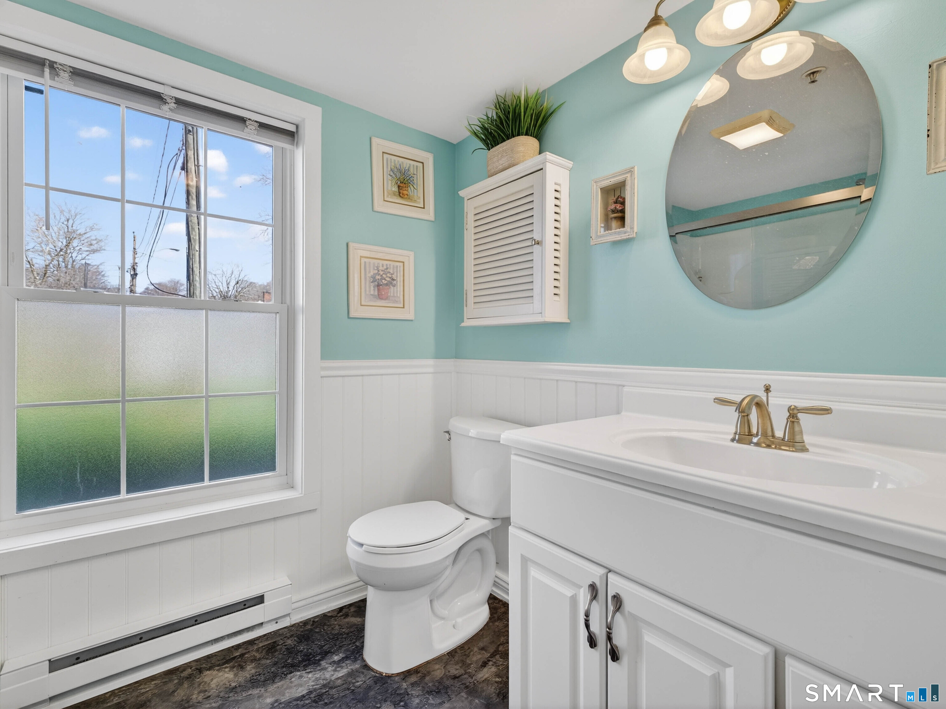 82 Sunset Street, Unit 68 Waterford, CT 06385 - Photo 11 of 20 a bathroom with a sink a toilet and a mirror